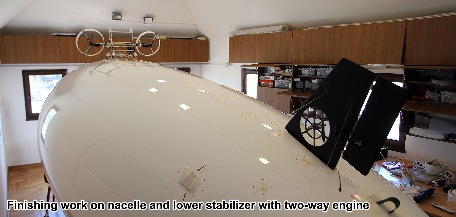 Finishing-work-on-nacelle-and-lower-stabilizer-with-two-way-engine-on-a-5-m-outdoor-RC-Blimp